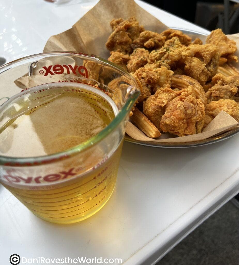Daily Beer Seoul with a plate of fried chicken, fries and Terra beer in a measuring cup