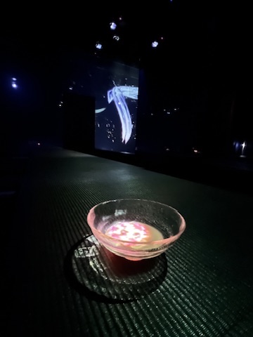 Tea served during an immersive digital art dining experience in Tokyo.
