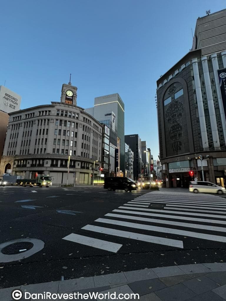 The Ginza district at dusk with the iconic Wako clock tower and luxury shops, a stylish option for where to stay in Tokyo.