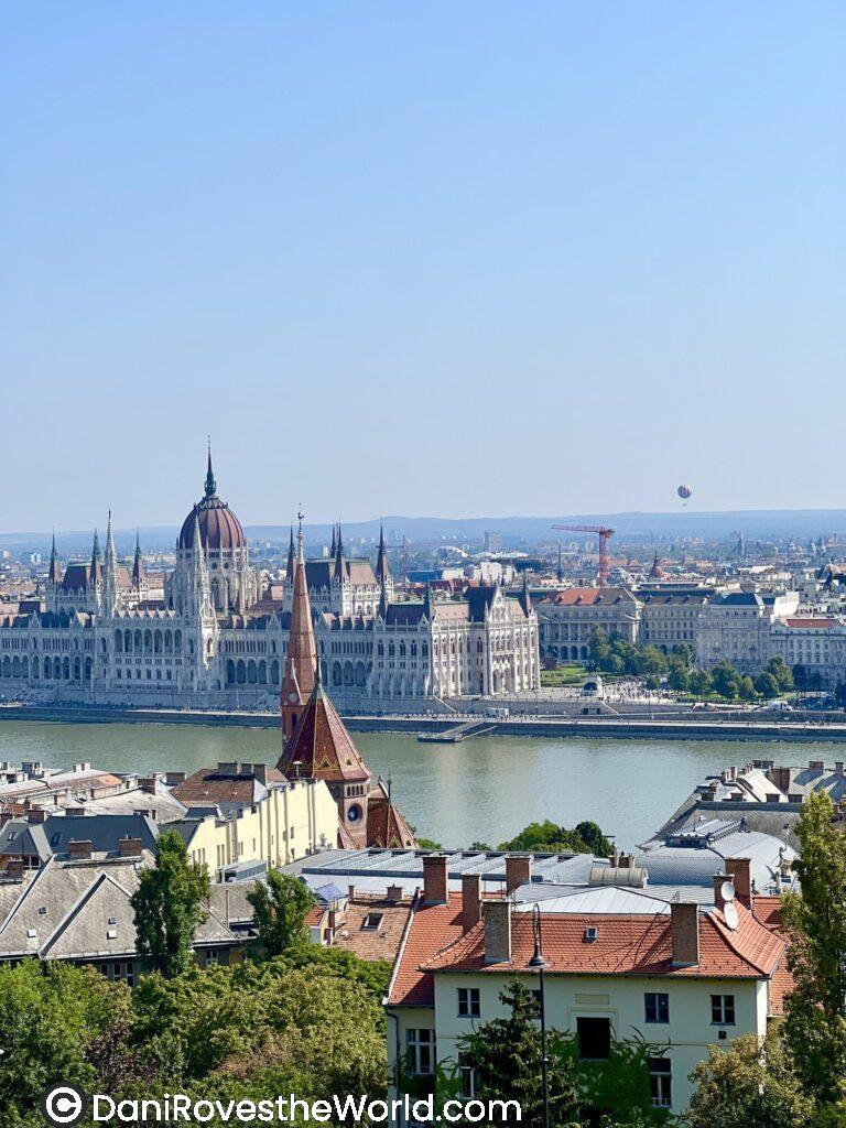 View of Budapest, Hungary, showcasing the iconic Hungarian Parliament building by the Danube River. Get taken off the main path and find hidden gems!