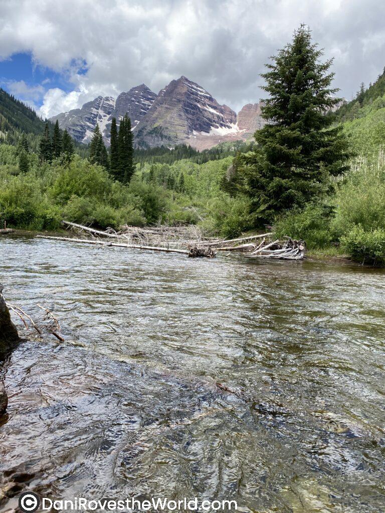 One piece of advice I always give about solo female travel and mental health is to take time out and do something that calms you down and brings you peace. For me this is water, a stream, a lake, the ocean. Not getting in it, just listening to it and looking at it. This picture of the mountains in Colorado with stream is relaxing and a great way to clear your mind and take care of your mental health.