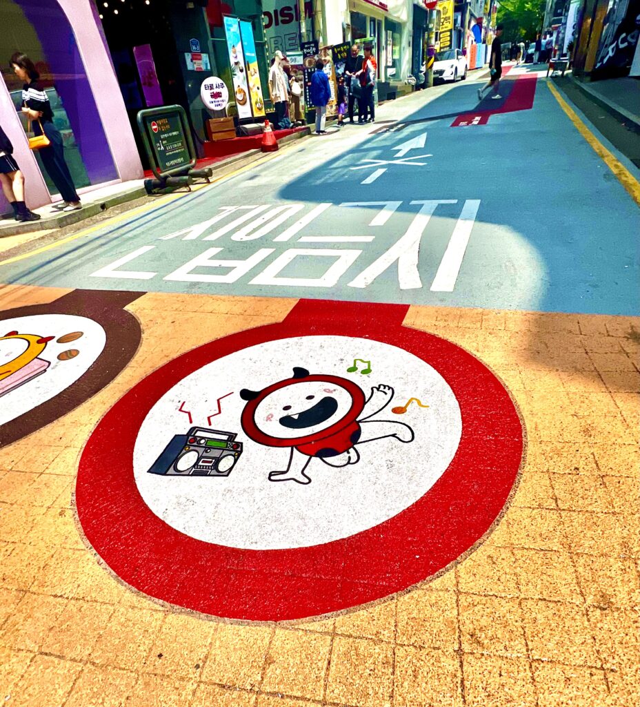 Vibrant colorful road markings on a pedestrian street in Hongdae, capturing a lively experience in Seoul