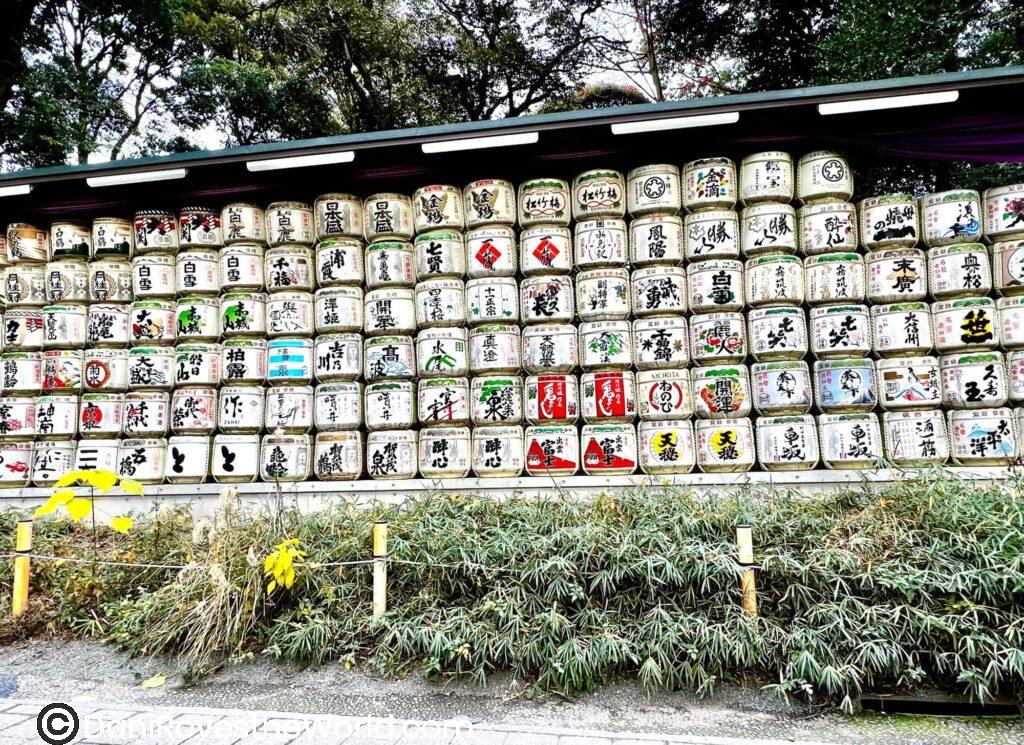 Decorative sake barrels displayed at Meiji Shrine in Tokyo, where breweries donate barrels as ceremonial offerings.