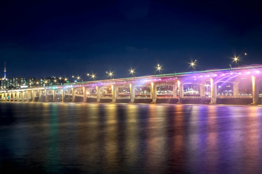 Han River at night turns into a rainbow show for locals. The colors reflect through the water and onto the River