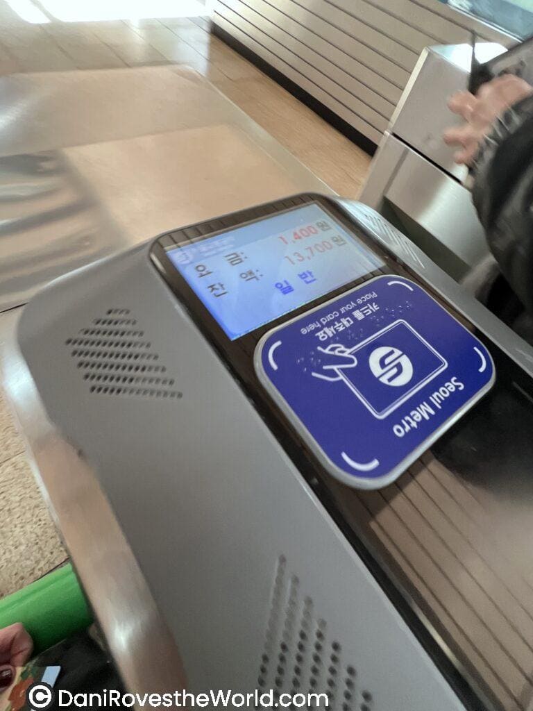 Transit card reader display
Close-up of a Seoul Metro transit card reader showing a fare of 1,400 KRW and remaining balance. Using a rechargeable T-money card is a key tip for how to get around Seoul as a solo traveler.