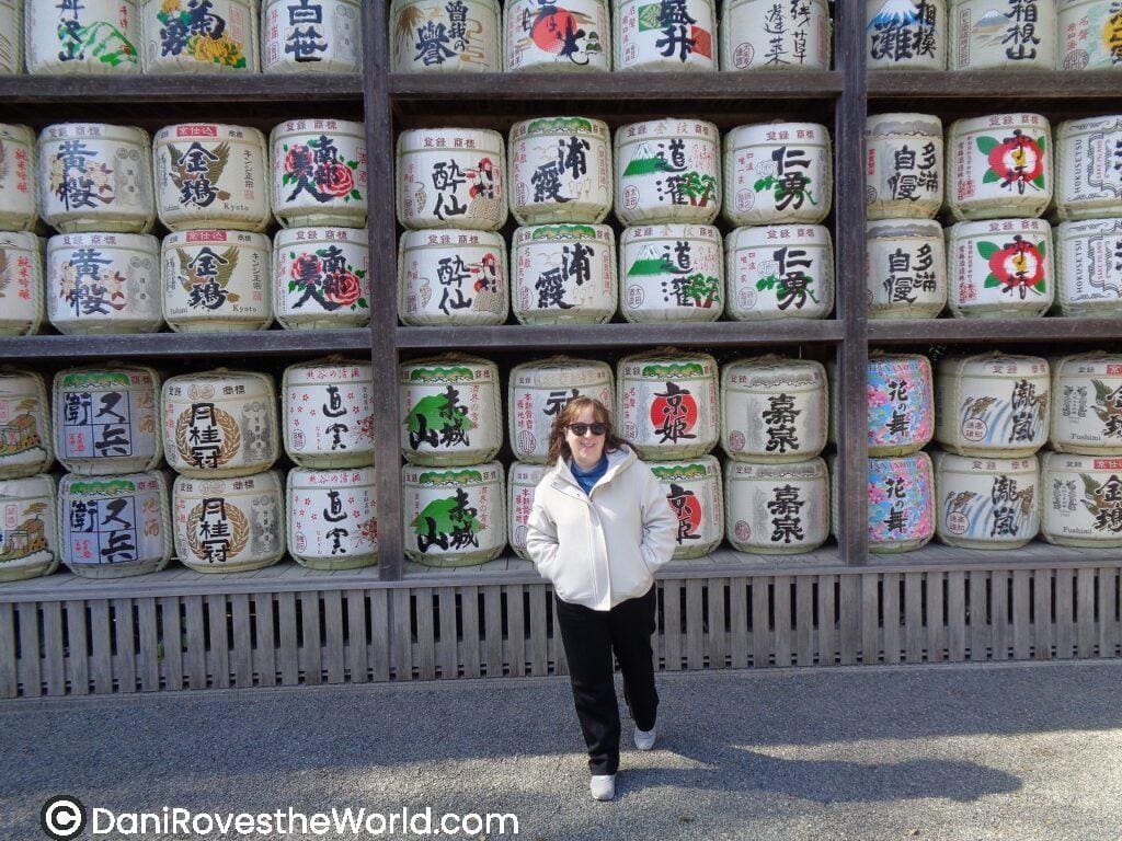 A vibrant wall of decorative sake barrels in Kamakura each painted with calligraphy and colorful labels—an iconic cultural stop that blends tradition into your Tokyo day trip.