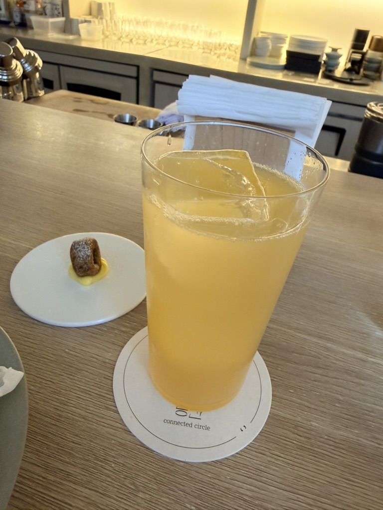 Craft cocktail served at a stylish bar with a light citrus flavor and minimalist presentation at Gong Gar Bar in Seoul